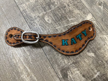 Hand tooled and painted spur straps
