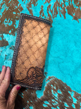 Hand tooled tally book