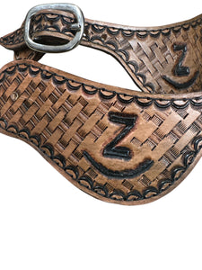Hand tooled and painted Custom Brand spur straps basketweave.