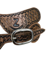 Hand tooled and painted Custom Brand spur straps basketweave.