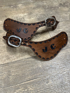 Hand tooled and painted custom spur straps brown and black