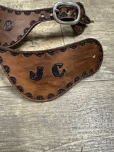Hand tooled and painted custom spur straps brown and black