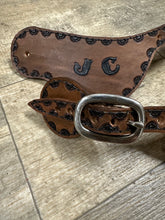 Hand tooled and painted custom spur straps brown and black