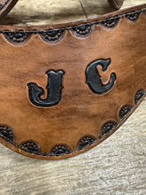 Hand tooled and painted custom spur straps brown and black