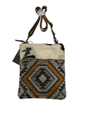 myra yellow and black cowhide canvas cross body  bag with tooled leather.