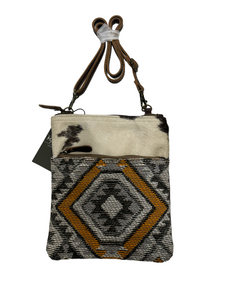 myra yellow and black cowhide canvas cross body  bag with tooled leather.