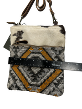 myra yellow and black cowhide canvas cross body  bag with tooled leather.
