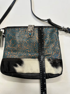 Myra  turquoise and black cowhide leather hand bag with tooled leather.