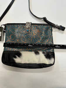 Myra  turquoise and black cowhide leather hand bag with tooled leather.