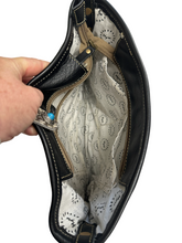 Myra  turquoise and black cowhide leather hand bag with tooled leather.