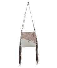 cowhide hand bag with leather strap and fringe
