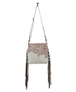 cowhide hand bag with leather strap and fringe