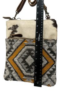 myra yellow and black cowhide canvas cross body  bag with tooled leather.